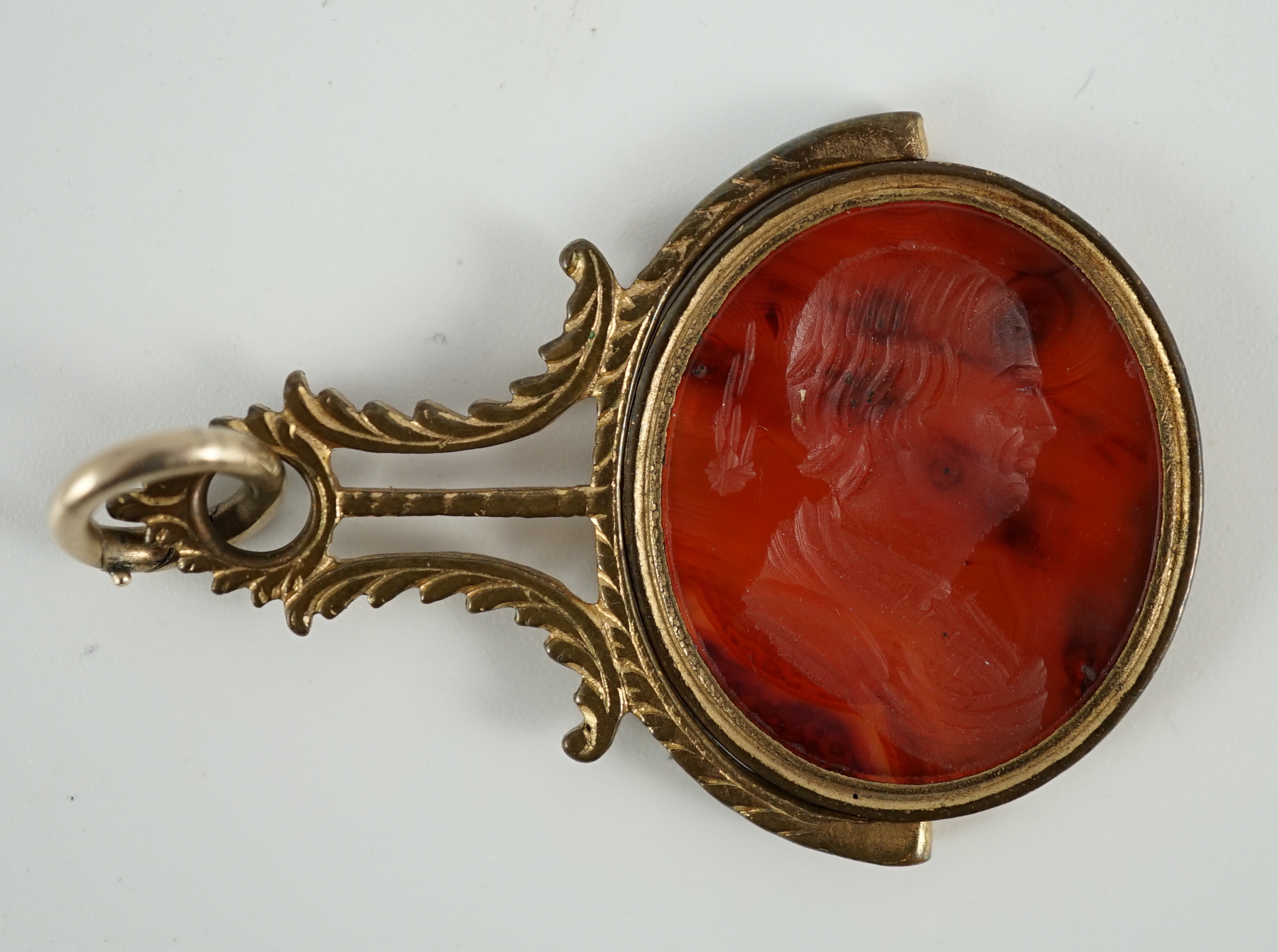 A late 18th/early 19th gilt metal mounted intaglio agate set swivelling fob seal, carved with the bust of Edmond Halley with the comet, 47mm, in original box.